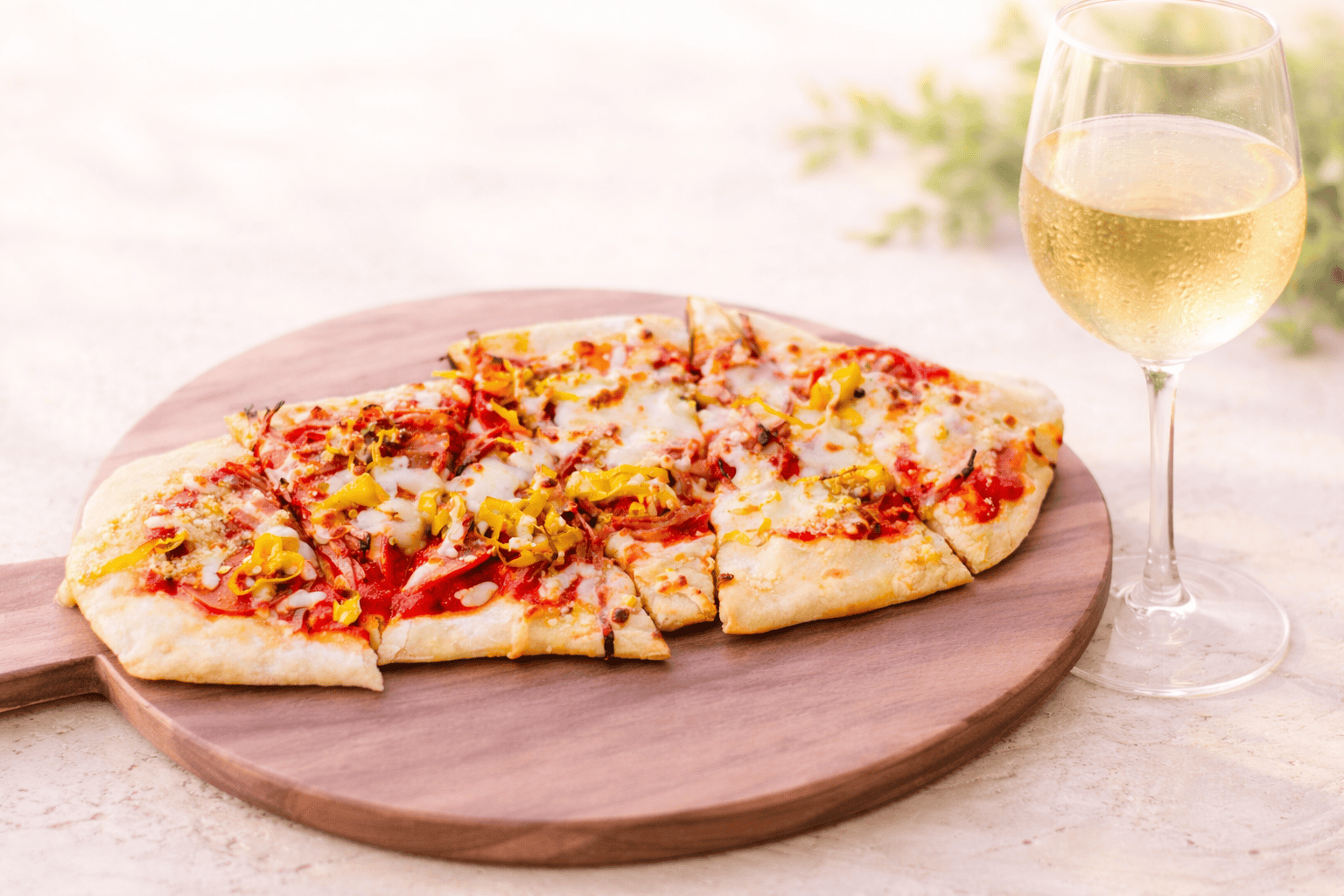 Fresh flatbread and a glass of white wine at The Vineyard Table vineyard restaurant near Indian Land SC.
