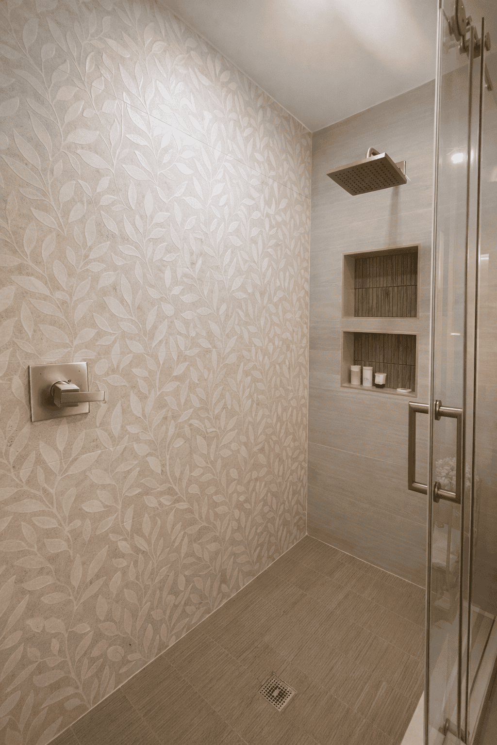 Modern walk-in shower in luxury bed and breakfast near Charlotte NC with brass rainfall showerhead, glass enclosure, and elegant tile design at Laurel Haven Estate vineyard